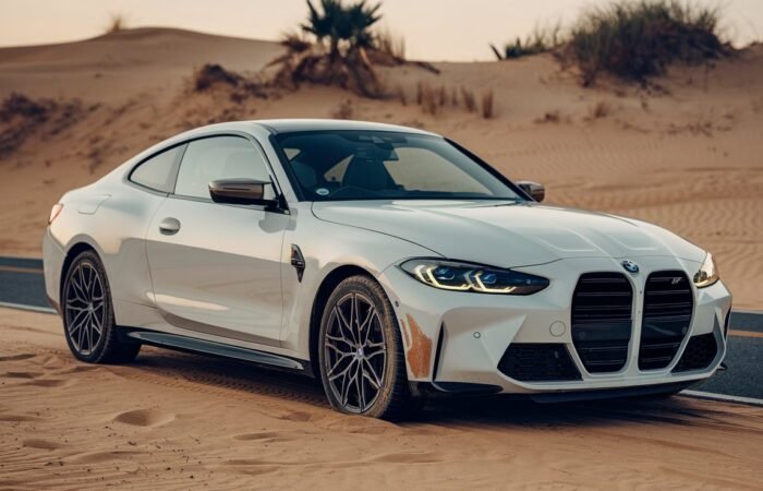 a-white-bmw-car-parked-on-a-desert-road-_XW0FM6vuTp6wuIYaTpVJPA_qUYanfH2SsWgnE3w2MZKbQ