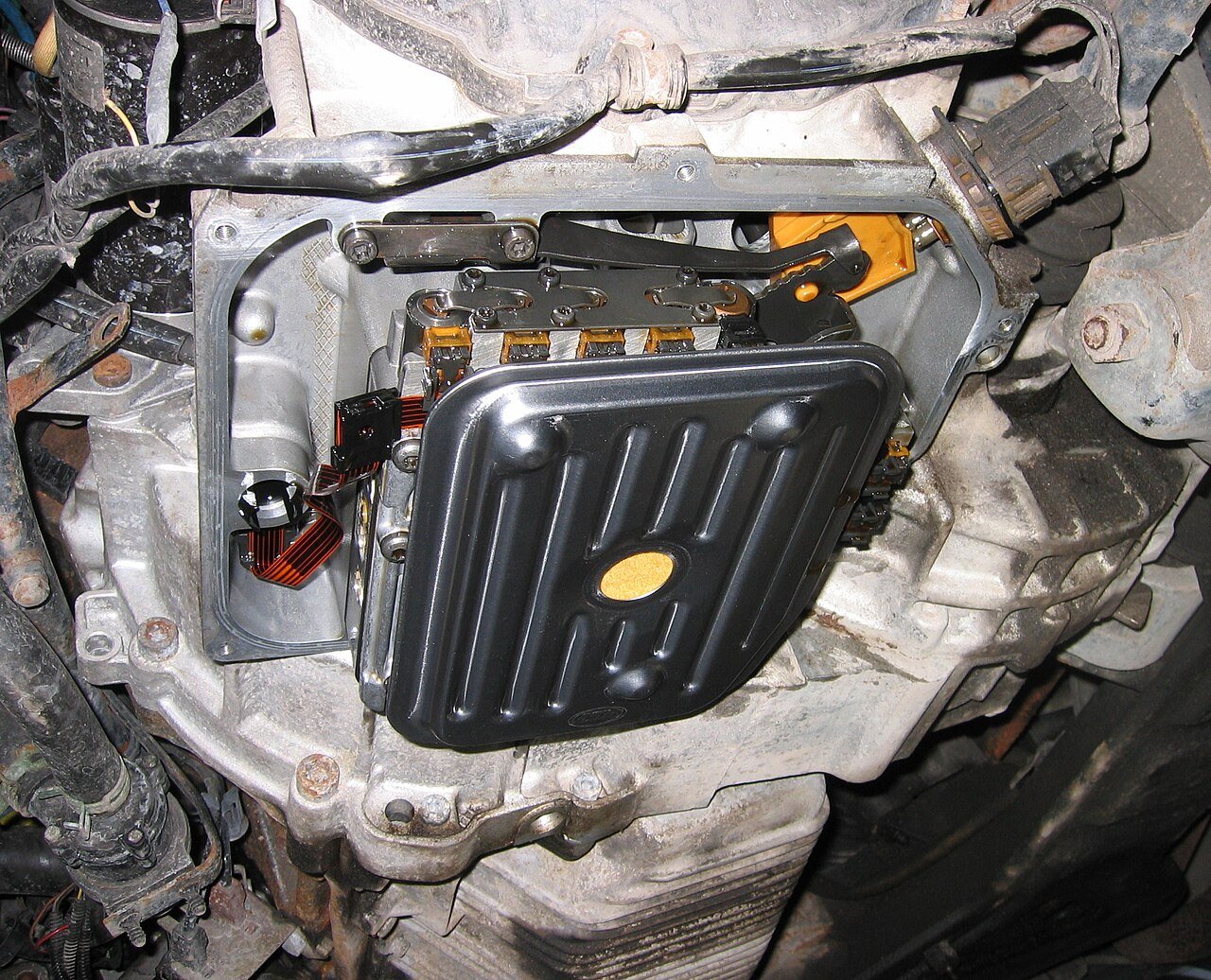 Filter and surrounding components inside an automatic transmission with its pan removed