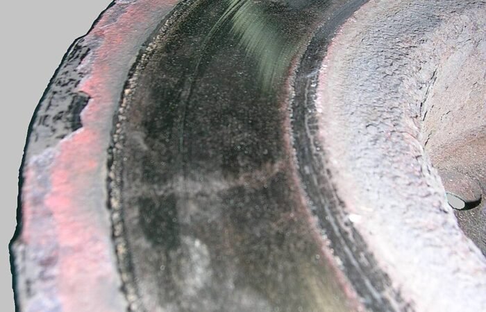 Removed brake rotor with severe surface wear and scoring