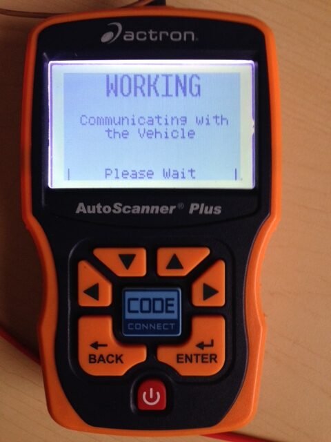 Handheld diagnostic scanner displaying a vehicle communication screen